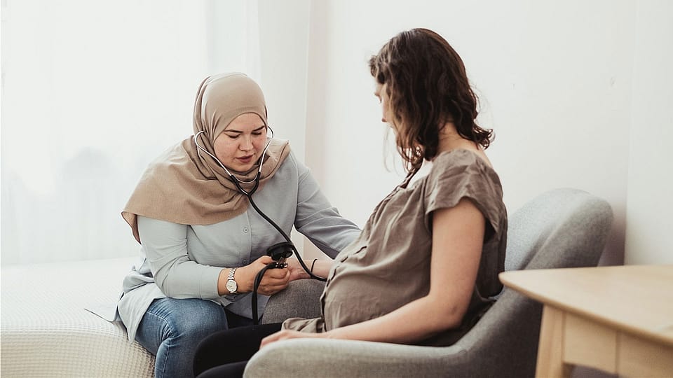pregnant woman and midwife